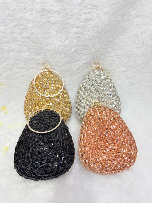 Set of four beaded earrings in gold, silver, black, and rose gold on a textured white background.