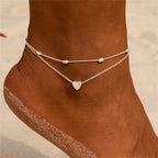 Elegante tobillera boho con perlas y dije de concha: perfecta para la playa, bodas y estilo diario.