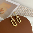 Pendientes de aro retro de doble bucle con diseño geométrico dorado y plateado.