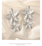 Pendientes Unift Vintage con diseño de flores para mujer: joyas bohemias de acero inoxidable chapado en oro de 14 quilates.