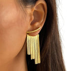 Pendientes llamativos con borlas doradas y brillantes: elegante diseño largo para mujer