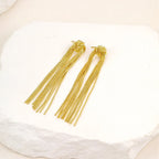 Pendientes llamativos con borlas doradas y brillantes: elegante diseño largo para mujer