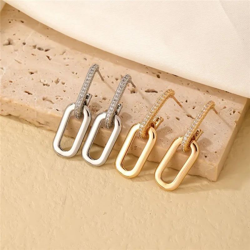 Pendientes de aro retro de doble bucle con diseño geométrico dorado y plateado.