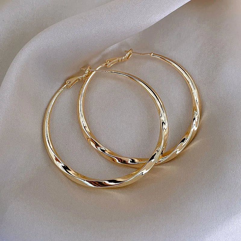 Mobius Twist Gold Hoop Earrings – Classic 50mm Statement Hoops for Women