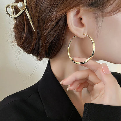 Mobius Twist Gold Hoop Earrings – Classic 50mm Statement Hoops for Women