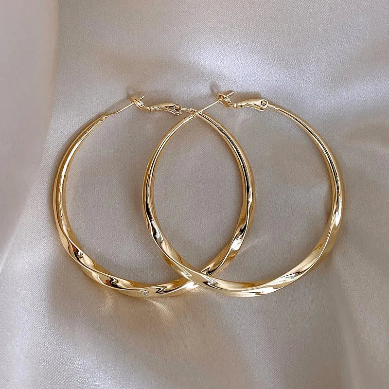 Mobius Twist Gold Hoop Earrings – Classic 50mm Statement Hoops for Women
