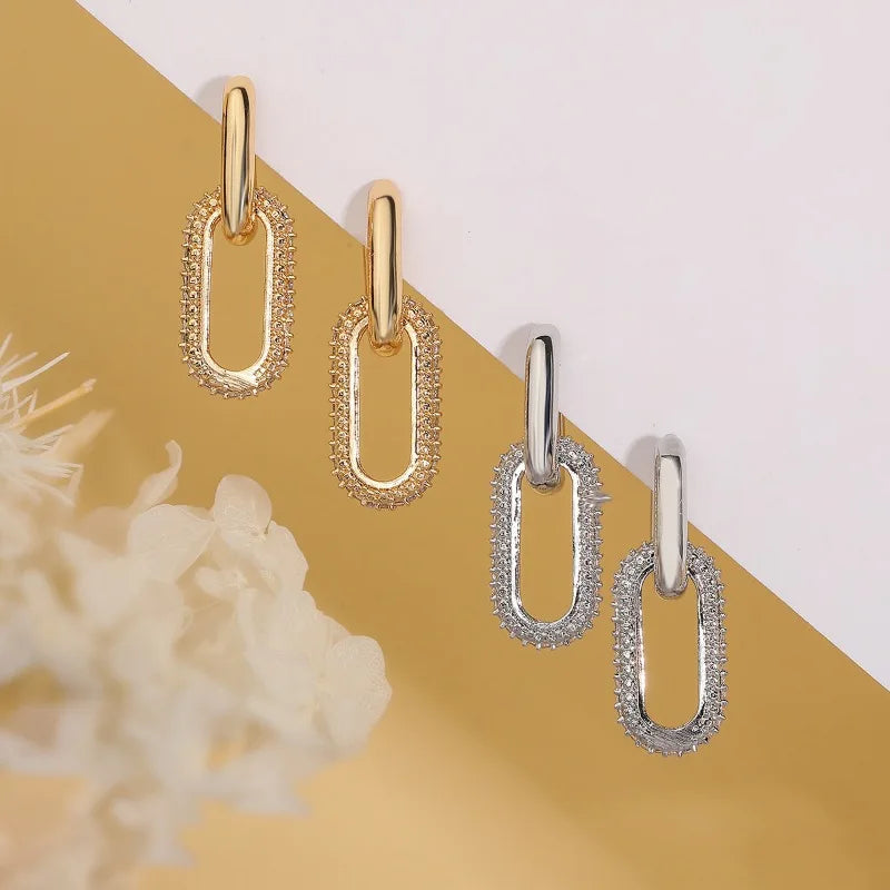 Pendientes de aro retro de doble bucle con diseño geométrico dorado y plateado.