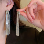 Pendientes largos de borlas de lujo exagerados: joyería llamativa con cadena geométrica dorada