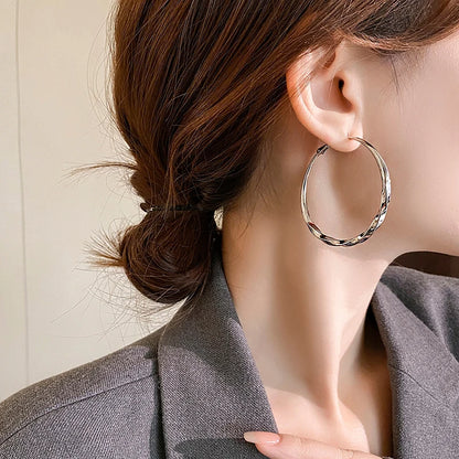 Mobius Twist Gold Hoop Earrings – Classic 50mm Statement Hoops for Women