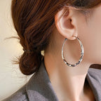 Aros dorados Mobius Twist: aros clásicos de 50 mm para mujer