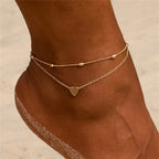 Elegante tobillera boho con perlas y dije de concha: perfecta para la playa, bodas y estilo diario.