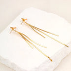 Pendientes llamativos con borlas doradas y brillantes: elegante diseño largo para mujer