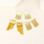 Pendientes llamativos con borlas doradas y brillantes: elegante diseño largo para mujer