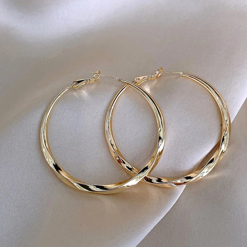 Mobius Twist Gold Hoop Earrings – Classic 50mm Statement Hoops for Women