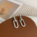 Pendientes de aro retro de doble bucle con diseño geométrico dorado y plateado.