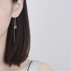 Elegantes pendientes de piedra lunar en forma de lágrima: cadena larga para mujer.