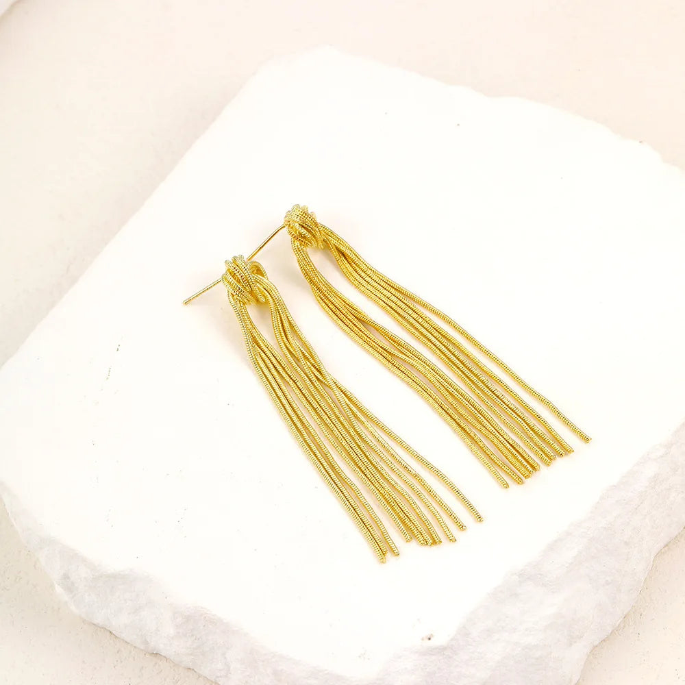 Pendientes llamativos con borlas doradas y brillantes: elegante diseño largo para mujer