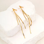 Pendientes llamativos con borlas doradas y brillantes: elegante diseño largo para mujer