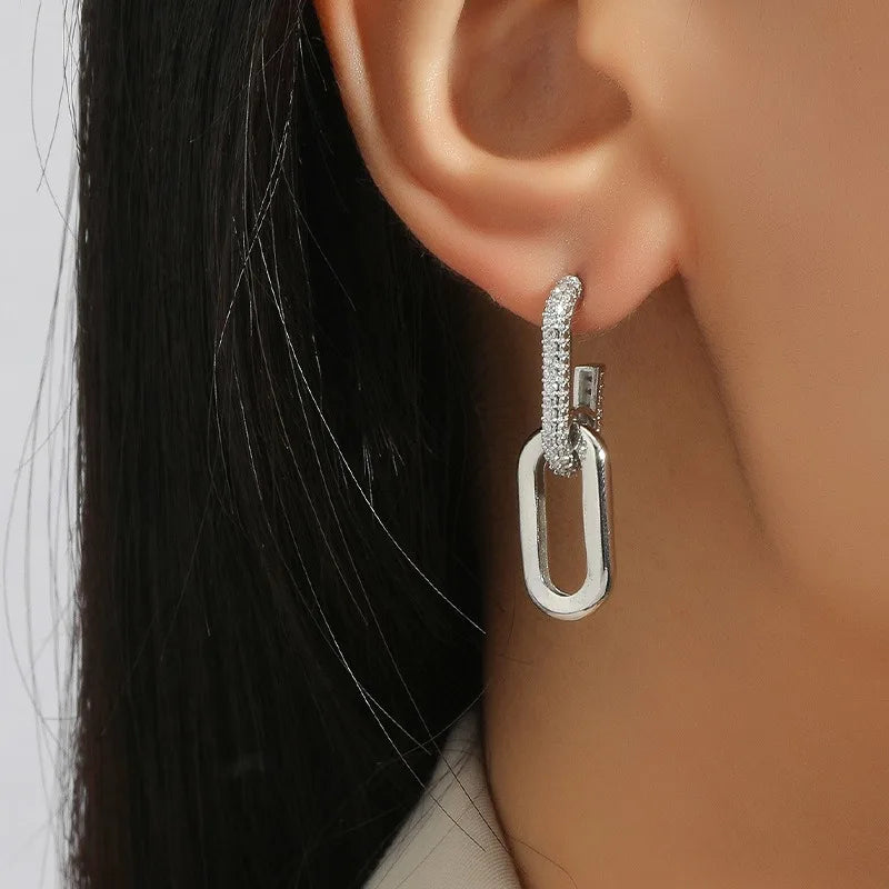 Pendientes de aro retro de doble bucle con diseño geométrico dorado y plateado.