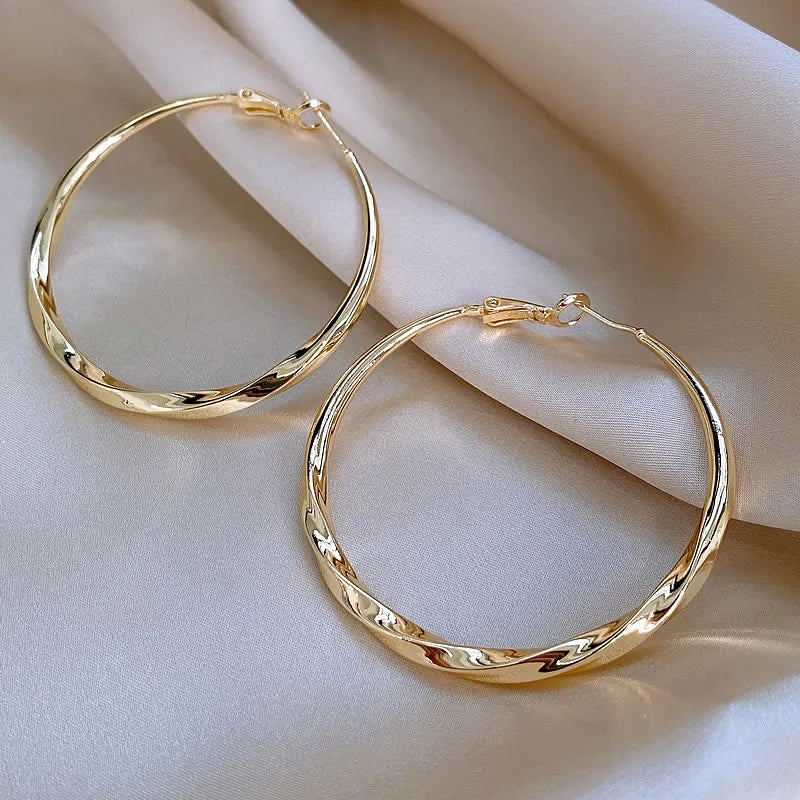 Mobius Twist Gold Hoop Earrings – Classic 50mm Statement Hoops for Women