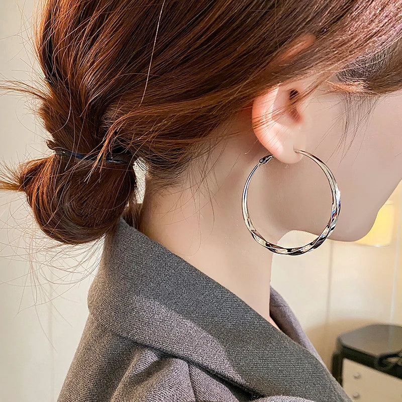 Mobius Twist Gold Hoop Earrings – Classic 50mm Statement Hoops for Women