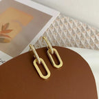 Pendientes de aro retro de doble bucle con diseño geométrico dorado y plateado.